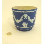 A Wedgwood jardiniere with jasper ware like decoration,