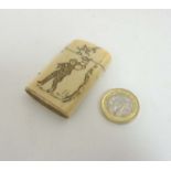 A Meiji period Japanese ivory vesta case with carved images to either side and striker under 2 3/4"