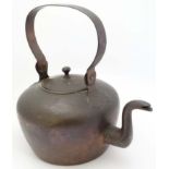 A large 19thC copper kettle with swing handle.