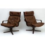 Vintage Retro : a pair of Danish brown leather open arm pedestal chairs ,