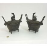 Pair Bronze Chinese Koros : a pair of bronze boat shaped lidded four footed ( with masks ) bronze