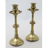 Decorative Metalware : Arts and crafts : A pair of mid - late 19thC brass candlesticks.
