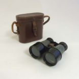 Binoculars : A cased pair of early 20thC field glasses ,