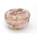 Lalique: A glass powder bowl and cover with scrolling Art Nouveau floral and female decoration.