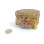 A Japanese millefleur satsuma tripod covered box of circular shape,