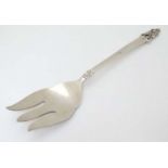 An American white metal serving fork by Rogers Bros.