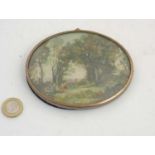 Miniature : an ivorine large oval of a Watteau type French landscape scene with figures dancing,