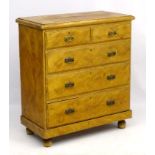 A Victorian pine chest of drawers comprising two short over three long drawers,