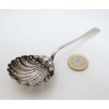 A silver sifter spoon with scallop shell formed bowl, Hallmarked Chester 1906 maker J & R Griffin.