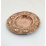 Decorative Metalware : An Arts and Crafts Newlyn? embossed circular copper dish with tadpole like
