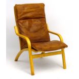 Vintage Retro : A Danish designed formed laminate lounge chair by Farstrupp with tan leather ,