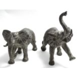 Two 21st C bronze figures of elephants.