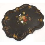 A papier- mache black painted tray with gilt hand painted decoration having mother of pearl inlay.