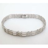 A silver bracelet with chain link decoration CONDITION: Please Note - we do not