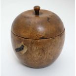 A 21stC novelty tea caddy formed as an apple Approx 4 3/4" high CONDITION: Please