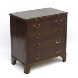 A 19thC mahogany small proportion chest of drawers comprising four long drawers and brushing slide,