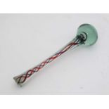 A Nailsea style short glass stick / baton with twist decoration and globular end.