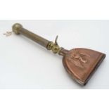A late 19thC / early 20thC horse grooming / singing brush of copper and brass construction with