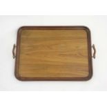 A c. 1900 mahogany and olive wood 2 handled tray , measuring 23” long x 17” wide.