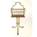 An Edwardian oak and brass magazine rack 31 3/4" high x 15" wide" CONDITION: Please