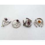 Four various Scottish silver brooches with thistle and stag decoration. All marked WB s. Sterling.