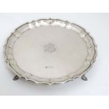 A silver visiting card tray / salver on four feet Hallmarked Chester 1909 maker Barker Brothers