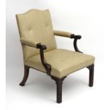 An 18thC Chippendale period mahogany Gainsborough style chair with open arms ,