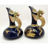 A pair of late 19thC Austrian, Robert Hanke style ewers having handles formed as griffins / dragons,