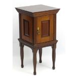 A late 19thC mahogany pot cupboard with yellow marble within, panelled door and shaped legs.