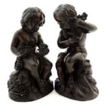 A pair of 21stC carved wooden cherubs in the Victorian style.