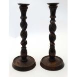 A pair of early 20thC carved oak twist candlesticks 12 3/4" high CONDITION: Please