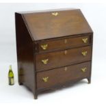 An 18thC mahogany Bureau with drop down section opening to reveal compartments and small drawers