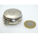 A small silver powder / patch box with mirror to hinged lid.