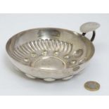 A large silver plate wine tasting bowl with loop handle 7" wide overall CONDITION: