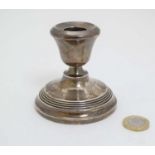 A silver candlestick hallmarked Birmingham 1970 maker Joseph Gloster Ltd.