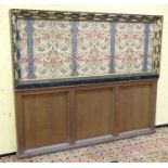 Arts & Crafts: An early 20thC oak Gothic screen / head board,