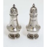 A pair of Victorian silver pepperettes hallmarked Sheffield 1894 maker Atkin Brothers 3 1/4" high