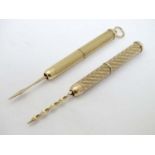 Two 9ct Gold propelling Toothpicks : a Hallmarked 9 & .