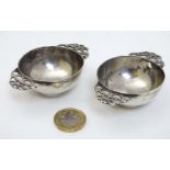 A pair of Victorian silver twin handled wine tasters hallmarked London 1891 maker James Wakely &