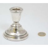 A silver candlestick hallmarked Birmingham 1976 maker Sanders & Mackenzie 3" high