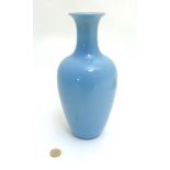 A Chinese monochrome blue 'Clair de Lune' (moonlight) glaze baluster vase with flared rim,