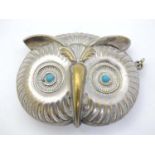 A novelty silver plate vesta case formed as the head of an owl with turquoise cabochon eyes.