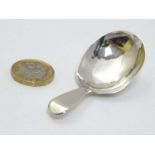 A Geo III silver caddy spoon hallmarked London 1806 maker Edward Lees 2 7/8" long