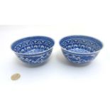 A pair of Chinese Blue and White bowls decorated with band of Morning glory / Convolvulus flower