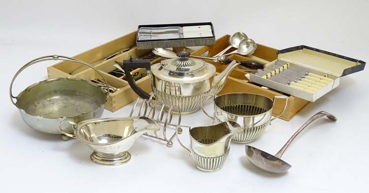 Assorted silver plated wares to include flatware, toast rack,