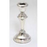 A silver candlestick hallmarked London 1920 maker Henry Hobson & Sons.