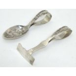 A child's silver spoon and pusher,