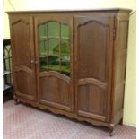 A c.1900 Louis XV style oak 3 sectional vitrine. 79" wide x 67 1/4" high x 18" deep.