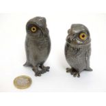 Two late 19thC / early 20thC novelty silver plate pepperettes formed as owls with glass eyes.