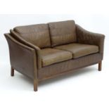 Vintage Retro: a Danish 2 seat sofa with brown leather upholstery and squared legs,